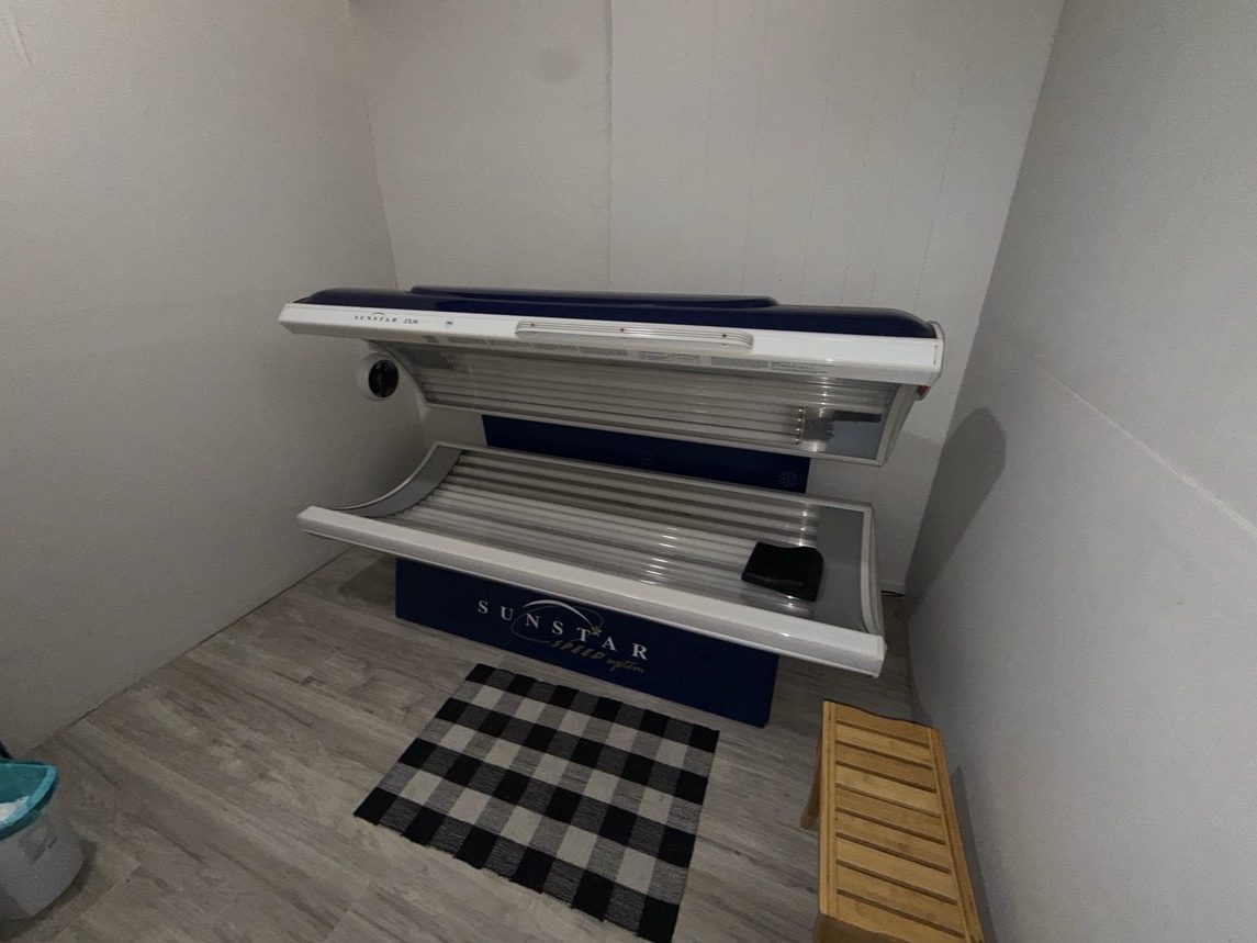 Private tanning room with a SunStar tanning bed